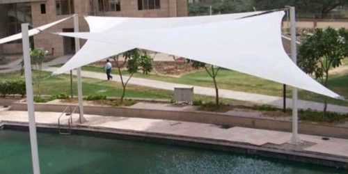 White retractable awning over pool